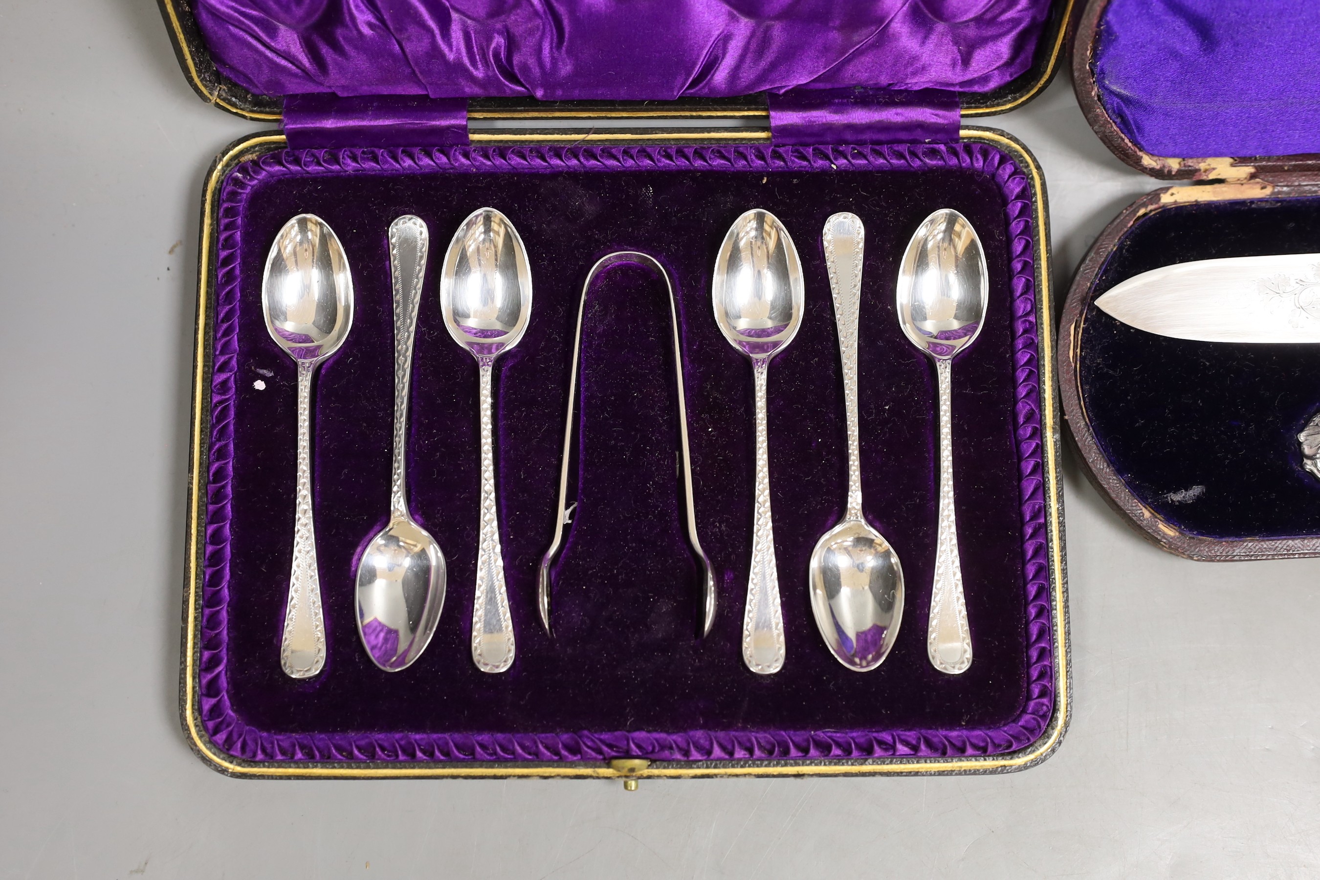 A Victorian cased silver knife and fork, Martin, Hall & Co, Sheffield, 1875 and a later cased set of six silver teaspoons and pair of sugar tongs.